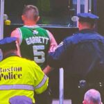 fan arrested for throwing water bottle at kyrie