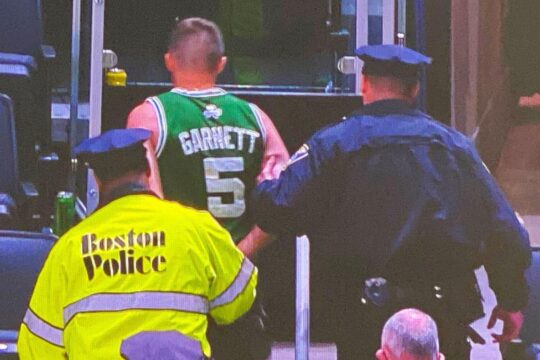 fan arrested for throwing water bottle at kyrie