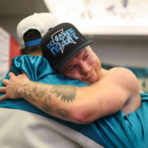 Canelo hugs coach